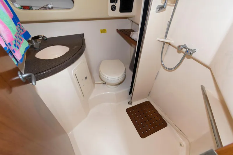 Slide: The Image of 2007 Grady-White Express 360 bathroom with shower, sink, and toilet. - 26
