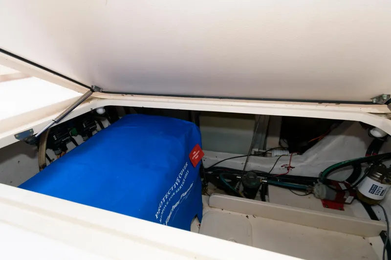 Slide: The Image of Engine compartment of 2007 Grady-White Express 360 boat with blue cover. - 27