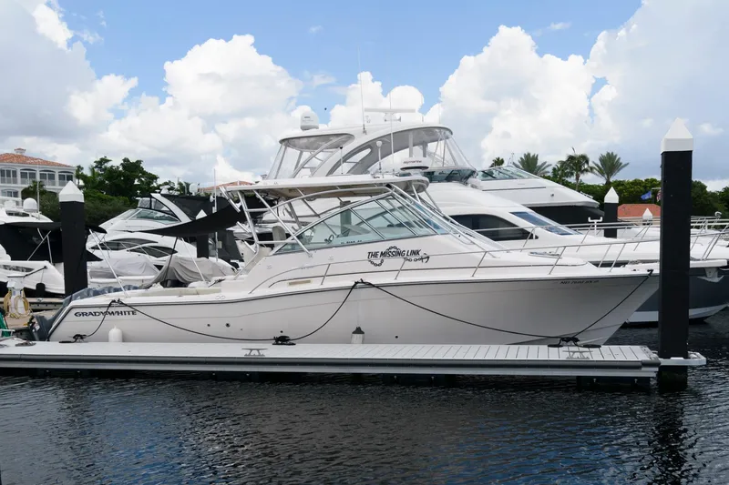 Slide: The Image of 2007 Grady-White Express 360 boat docked at marina under cloudy sky. - 5