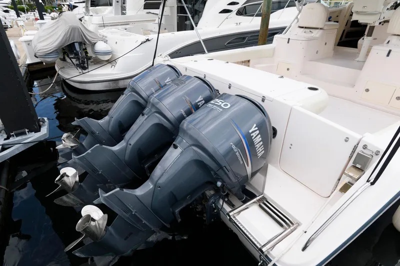 Slide: The Image of 2007 Grady-White Express 360 with triple Yamaha outboard motors docked at marina. - 7