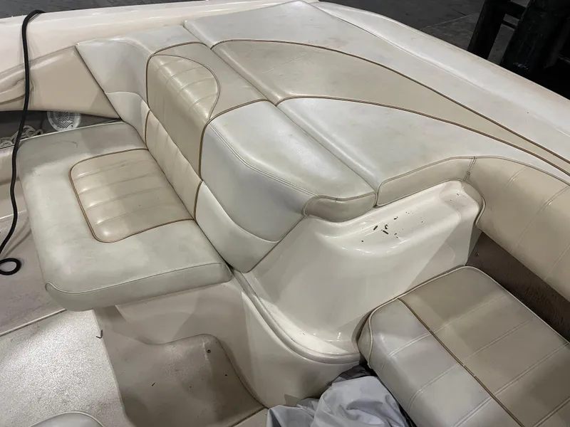 Slide: The Image of 1995 Sea Ray Signature Select boat interior with beige leather seating. - 10