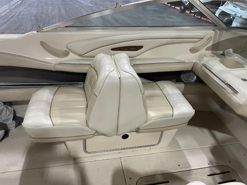 Slide: The Image of 1995 Sea Ray Signature Select boat interior with white leather seats and sleek design. - 12