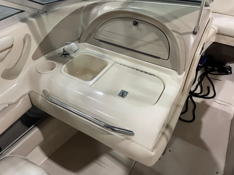 Slide: The Image of 1995 Sea Ray Signature Select boat interior with sink and storage compartment. - 16