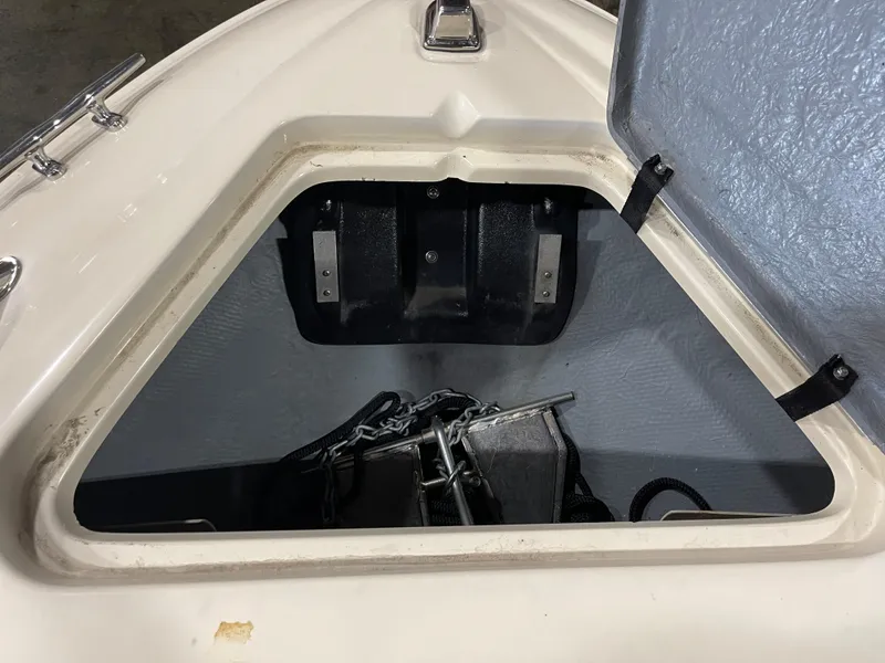Slide: The Image of Open anchor compartment on 1995 Sea Ray Signature Select boat. - 18