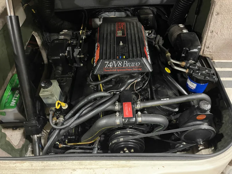 Slide: The Image of Engine compartment of a 1995 Sea Ray Signature Select boat, featuring a 7.4L V8 Bravo engine. - 20