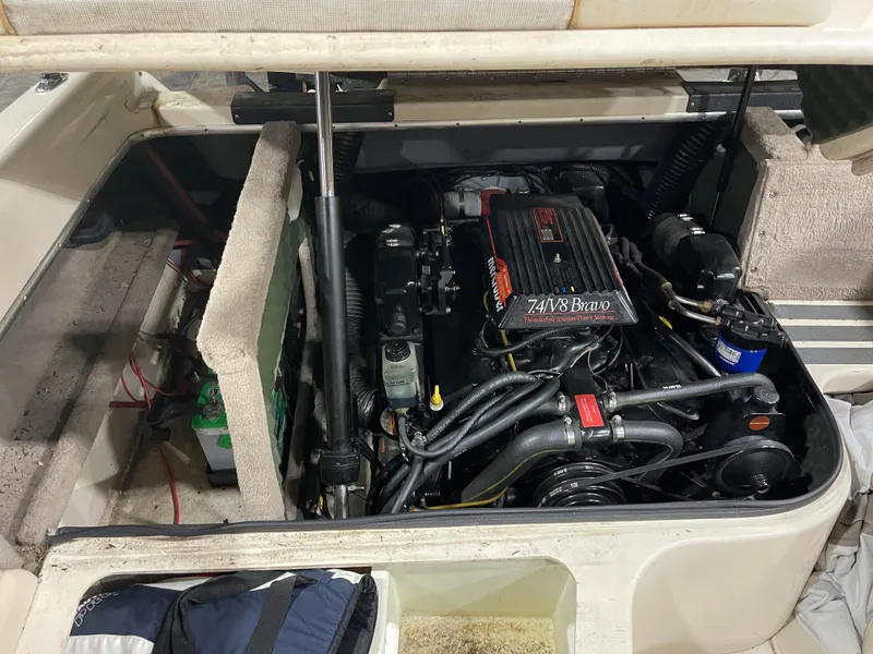 Slide: The Image of Engine compartment of a 1995 Sea Ray Signature Select boat, featuring a 7.4L V8 Bravo engine. - 21