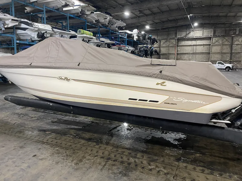 Slide: The Image of 1995 Sea Ray Signature Select boat covered in storage facility. - 7
