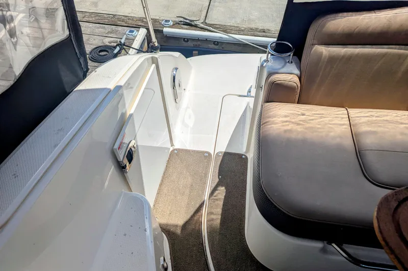 Slide: The Image of 2017 Sea Ray Sundancer 280 interior with seating and deck view. - 19