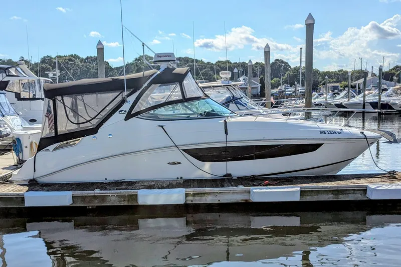 Slide: The Image of 2017 Sea Ray Sundancer 280 docked at marina under clear blue sky. - 2