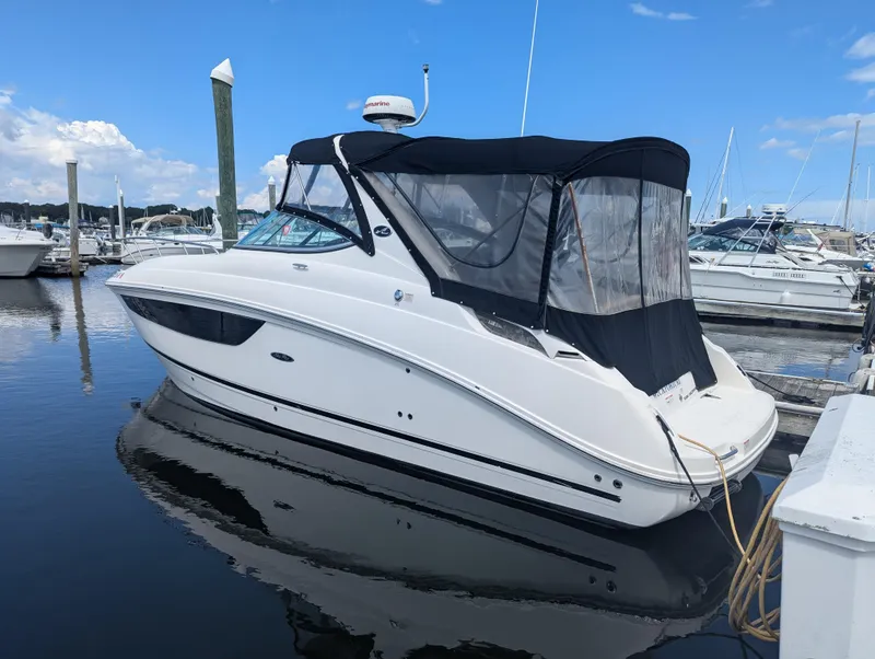 Slide: The Image of 2017 Sea Ray Sundancer 280 docked at marina under clear blue sky. - 3