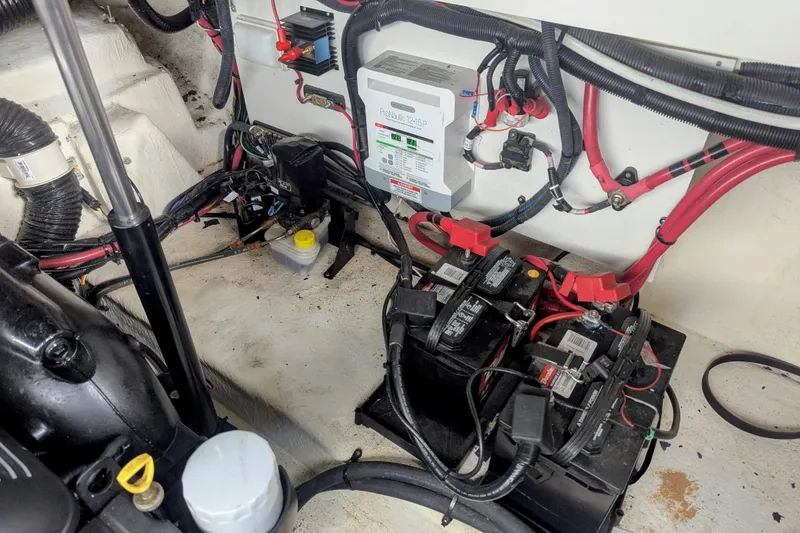 Slide: The Image of Engine compartment of 2017 Sea Ray Sundancer 280 with batteries and wiring. - 33
