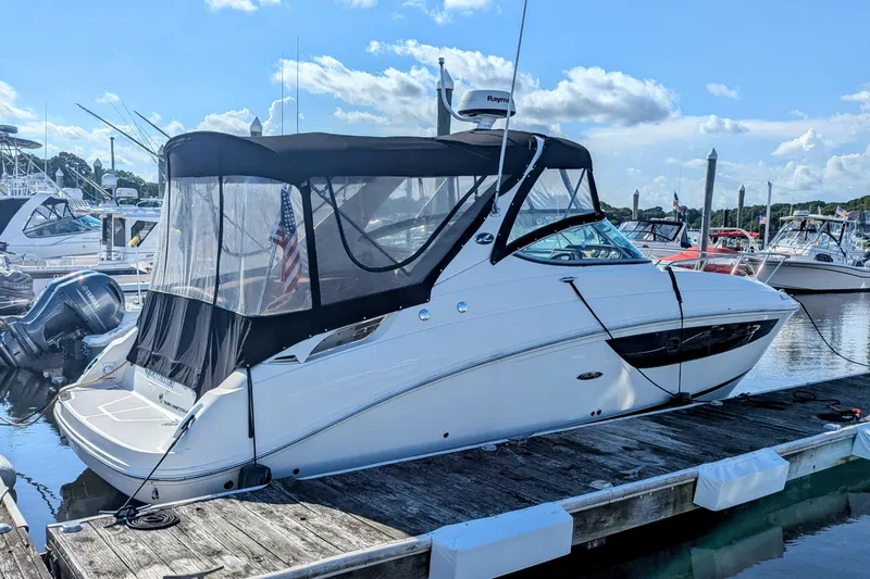 Slide: The Image of 2017 Sea Ray Sundancer 280 docked at marina under clear blue sky. - 4