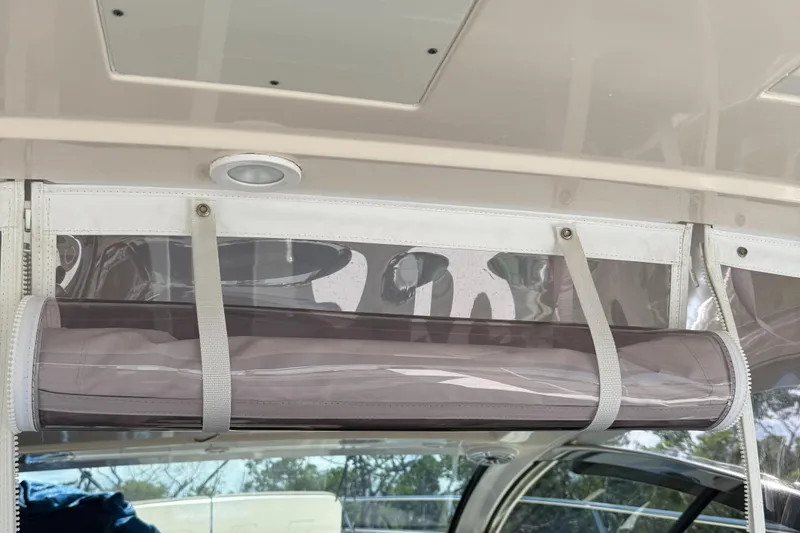 Slide: The Image of Clear vinyl enclosure on 2013 Pursuit 365i Sport Coupe boat. - 23