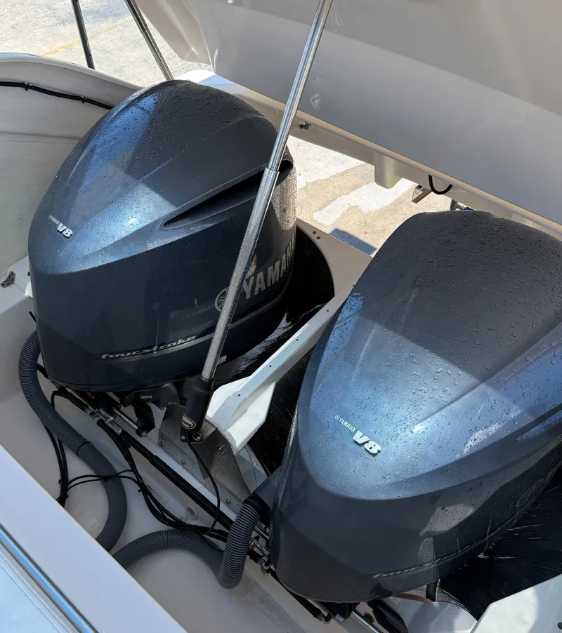 Slide: The Image of Twin Yamaha V8 engines on a 2013 Pursuit 365i Sport Coupe boat. - 24