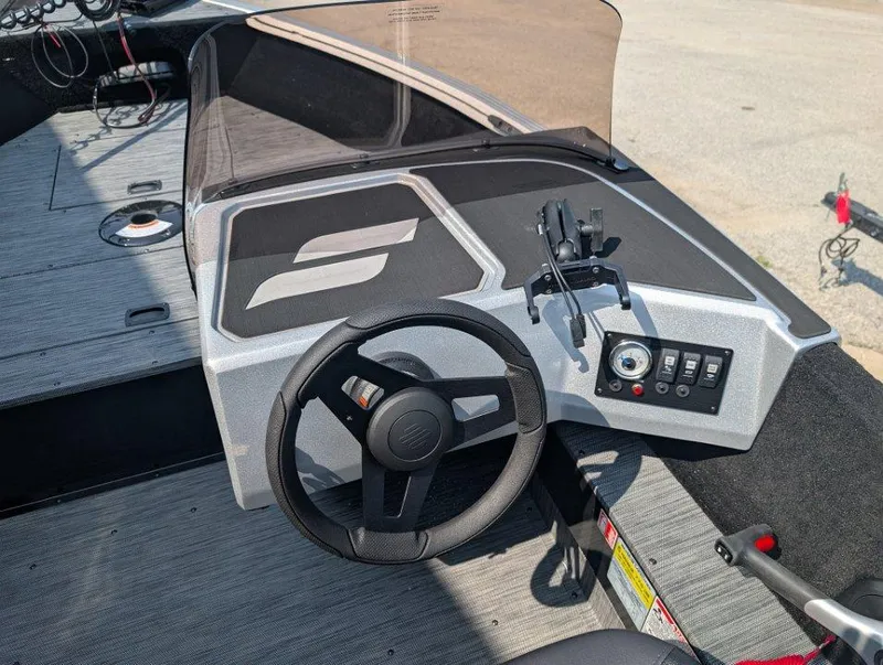 Slide: The Image of 2026 Starcraft 166 Starfish boat dashboard with steering wheel and control panel. - 5