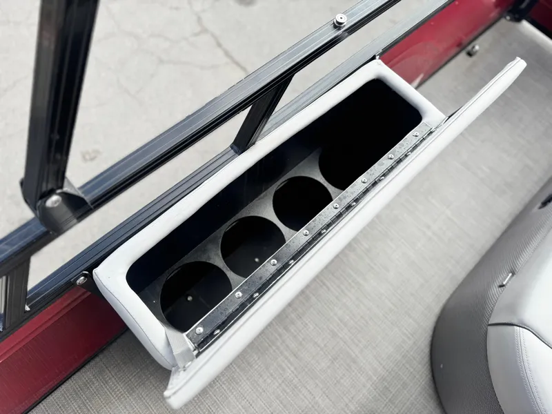Slide: The Image of 2023 Regency 250 DL3 boat cup holder detail with open compartment. - 15