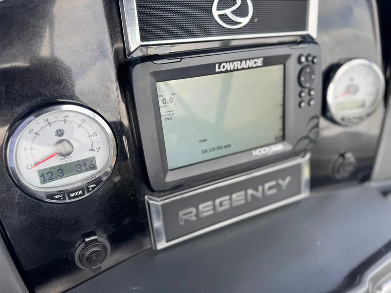Slide: The Image of Dashboard of 2023 Regency 250 DL3 with Lowrance display and gauges. - 24