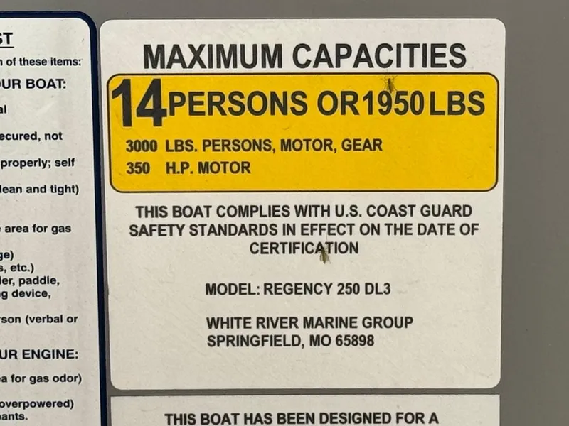 Slide: The Image of 2023 Regency 250 DL3 boat capacity label: 14 persons, 1950 lbs, 350 HP motor compliance. - 28