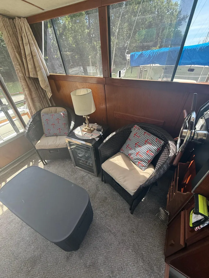 Slide: The Image of Interior of 1985 Marinette 32 Sedan with cozy seating and nautical decor. - 19