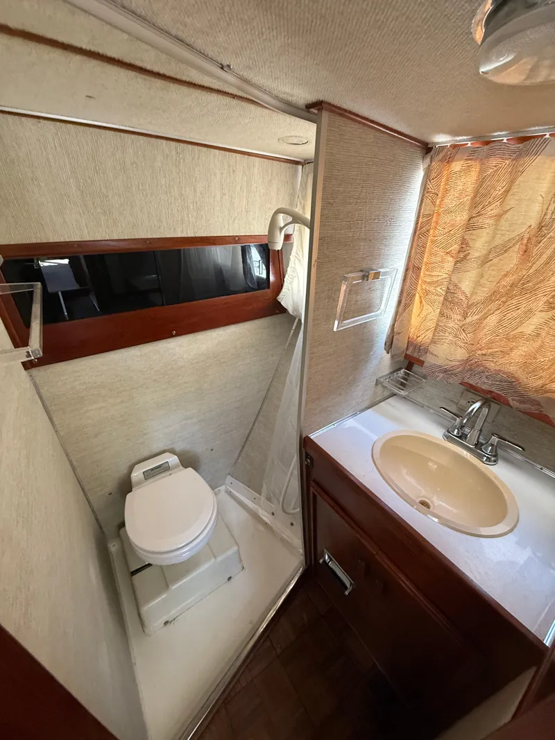 Slide: The Image of Compact bathroom in 1985 Marinette 32 Sedan with toilet, sink, and shower. - 26