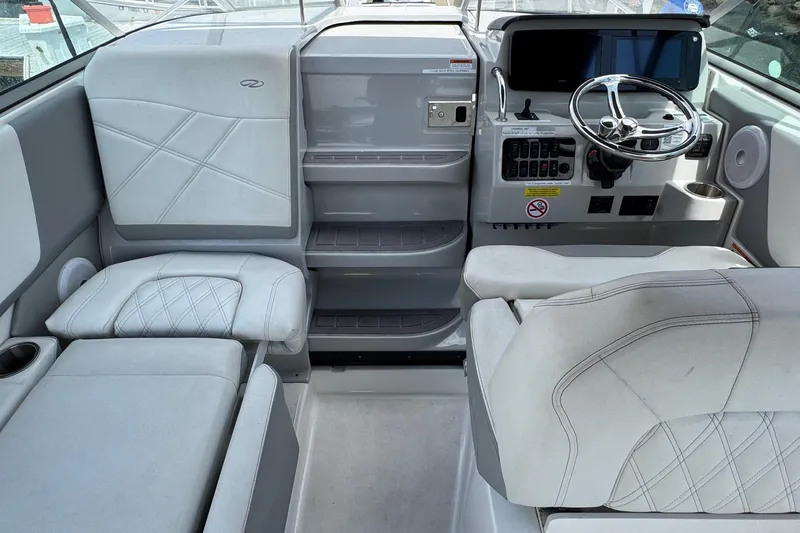 Slide: The Image of 2023 Regal 26 XO boat interior with modern helm and comfortable seating. - 10