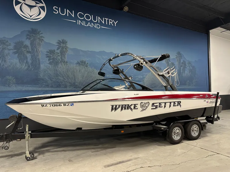 Slide: The Image of 2010 Malibu Wakesetter 247 LSV boat on trailer at Sun Country Inland showroom. - 2