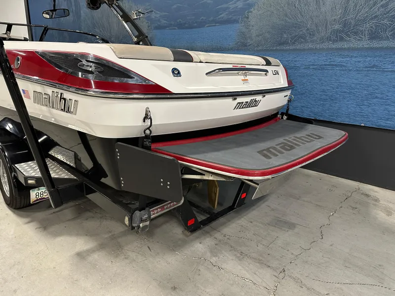 Slide: The Image of 2010 Malibu Wakesetter 247 LSV boat on trailer, rear view, indoors. - 4
