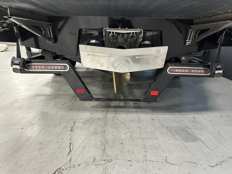 Slide: The Image of 2010 Malibu Wakesetter 247 LSV boat underside with propeller and wakeboard features. - 5