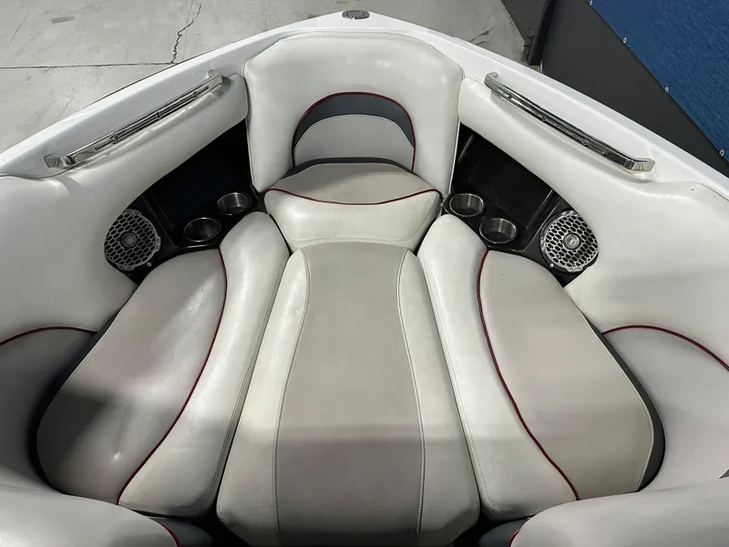 Slide: The Image of Interior seating of a 2010 Malibu Wakesetter 247 LSV boat with cup holders and speakers. - 8