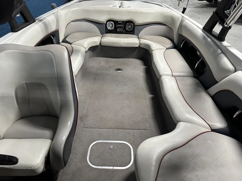 Slide: The Image of Interior of a 2010 Malibu Wakesetter 247 LSV boat with spacious seating and modern design. - 9