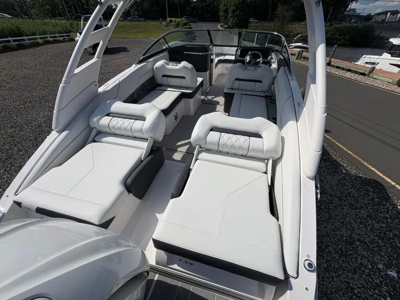 Slide: The Image of 2025 Regal LX4 boat interior with luxurious white seating and modern design. - 10