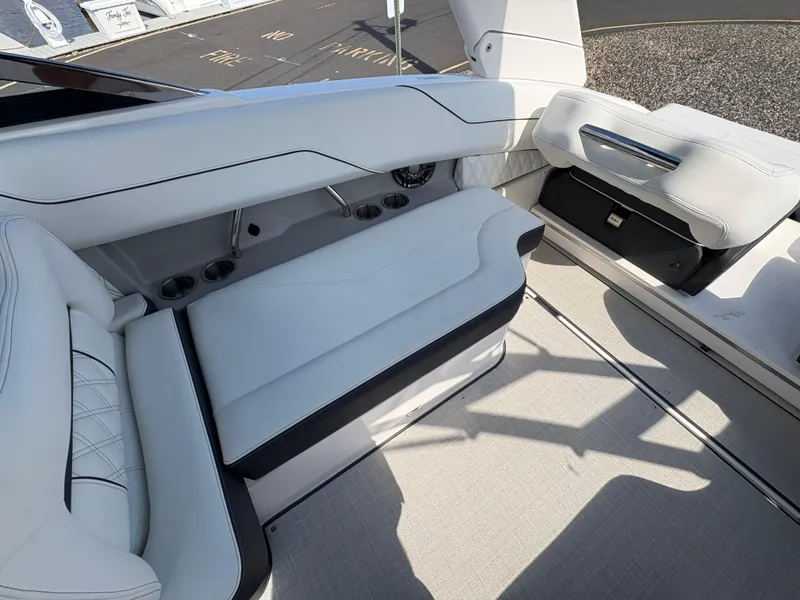 Slide: The Image of Luxurious seating on 2025 Regal LX4 boat, featuring sleek white upholstery and modern design. - 13