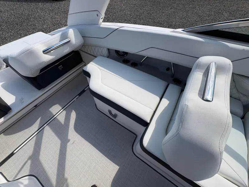 Slide: The Image of Luxurious interior seating of 2025 Regal LX4 boat with sleek white upholstery. - 14