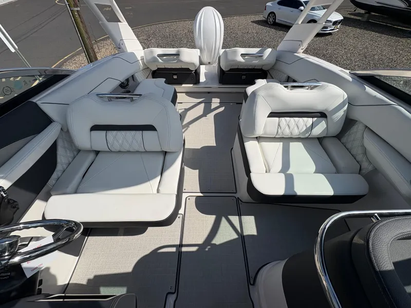 Slide: The Image of Luxurious interior of 2025 Regal LX4 boat with plush white seating and modern design. - 15