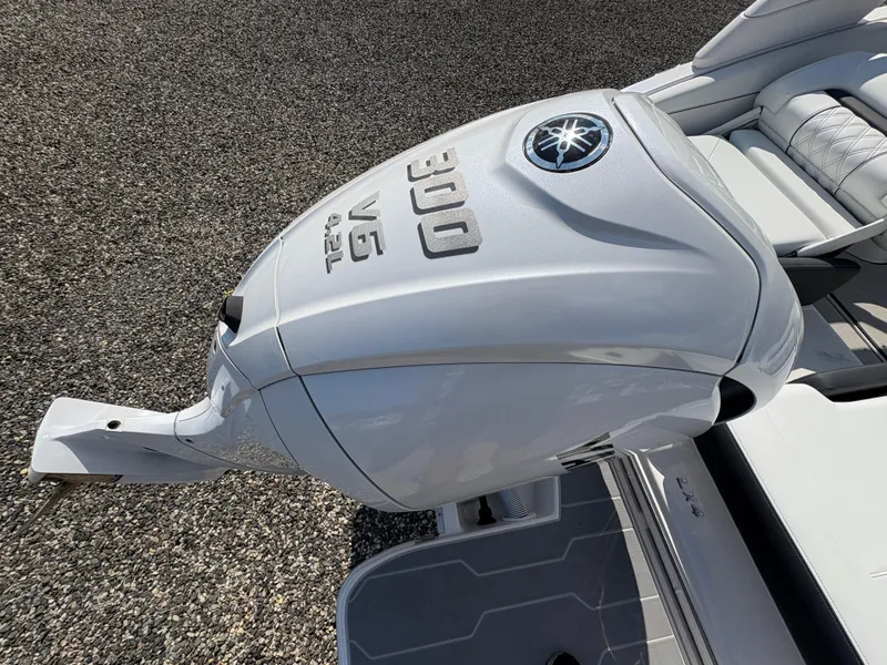 Slide: The Image of 2025 Regal LX4 boat with powerful 300 V6 outboard engine, sleek white design. - 24