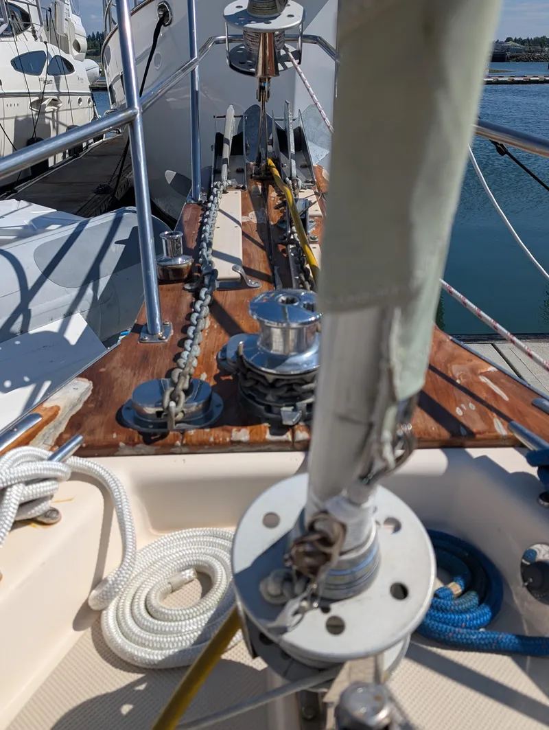 Slide: The Image of Deck view of a 1994 Island Packet 35 sailboat with ropes and winches. - 12