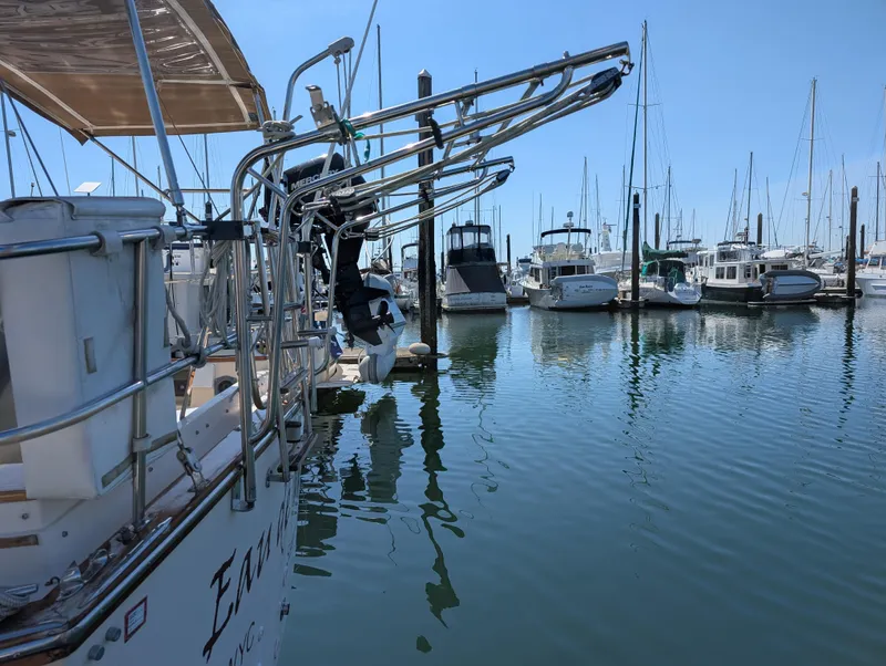 Slide: The Image of Sailboats docked at a marina, featuring a 1994 Island Packet 35. - 18