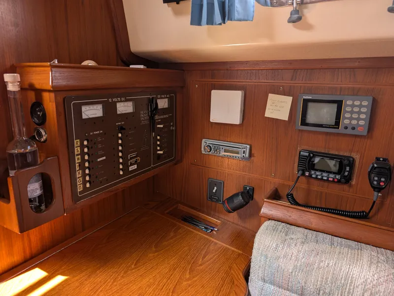 Slide: The Image of Interior of a 1994 Island Packet 35 sailboat with navigation and control panels. - 39