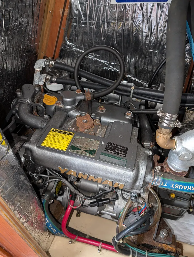 Slide: The Image of Engine of a 1994 Island Packet 35 sailboat, featuring Yanmar components. - 46