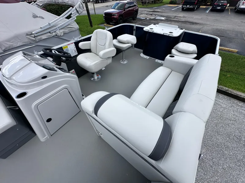 Slide: The Image of 2026 Sylvan Mirage Fish 820 Party Fish 4.0 interior with seating and steering console. - 11