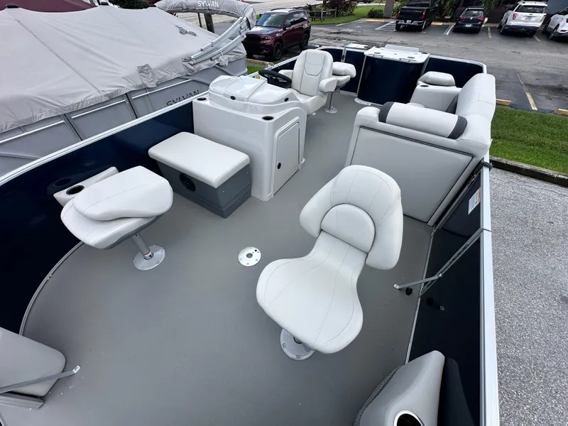 Slide: The Image of 2026 Sylvan Mirage Fish 820 Party Fish 4.0 pontoon boat interior with white seating. - 6