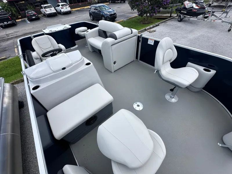 Slide: The Image of 2026 Sylvan Mirage Fish 820 Party Fish 4.0 pontoon boat interior with white seating. - 7