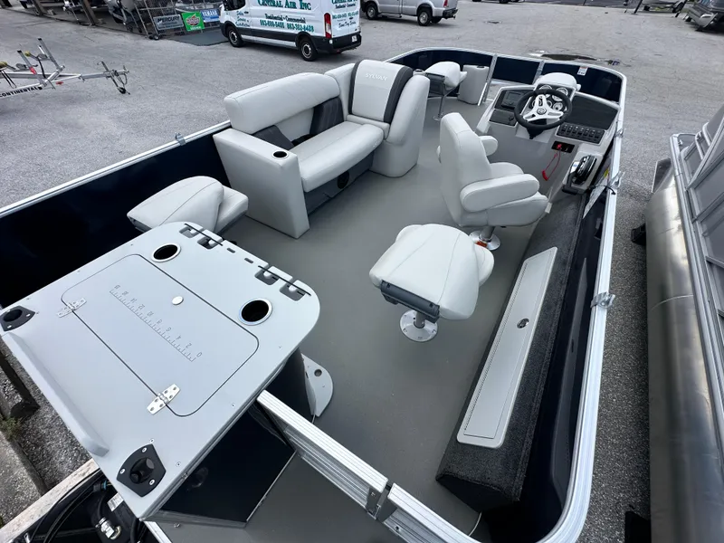 Slide: The Image of 2026 Sylvan Mirage Fish 820 Party Fish 4.0 interior with seating and control console. - 8