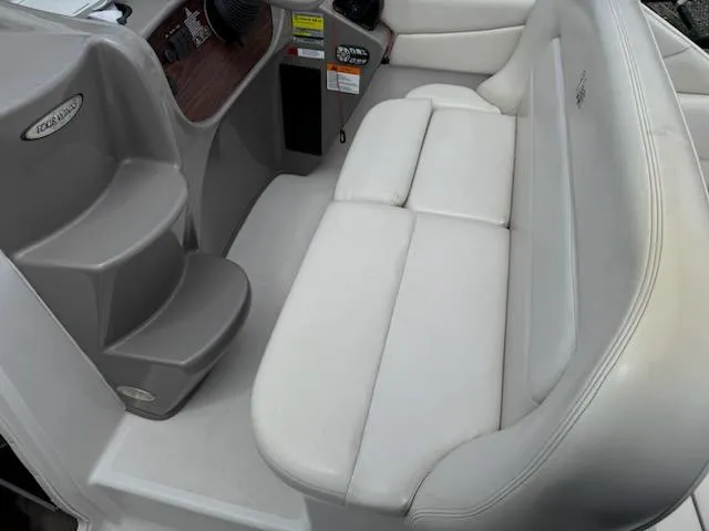 Slide: The Image of 2001 Four Winns 248 Vista boat interior with white seating and dashboard. - 13