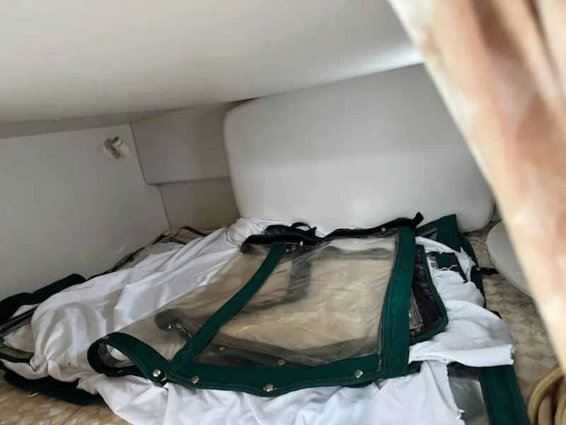 Slide: The Image of Interior cabin of 2001 Four Winns 248 Vista boat with folded canopy. - 18