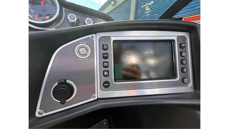 Slide: The Image of Dashboard of a 2017 MasterCraft X23 boat with touchscreen and controls. - 10