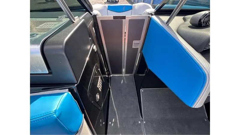 Slide: The Image of 2017 MasterCraft X23 interior with blue and black seating, sleek design. - 23