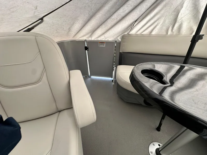 Slide: The Image of Interior of 2025 Sylvan Mirage 818 Cruise pontoon boat with seating and table. - 21