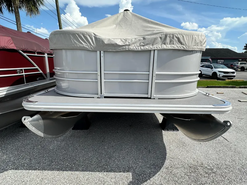 Slide: The Image of 2025 Sylvan Mirage 818 Cruise pontoon boat with cover, parked outdoors. - 3