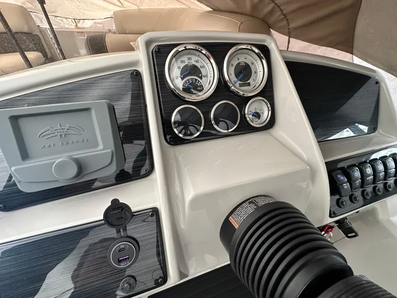 Slide: The Image of 2025 Sylvan Mirage 818 Cruise dashboard with gauges, controls, and Wet Sounds audio system. - 5